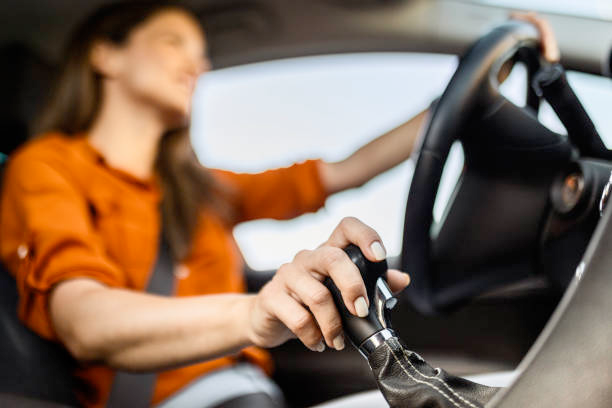 A confident driver shifting gears in a performance car